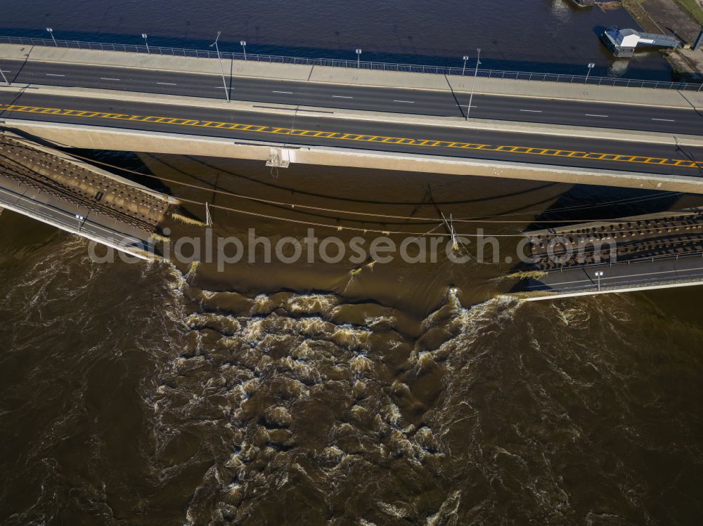 Dresden from above - Concrete segments of the collapsed river bridge structure for crossing the Elbe Carolabruecke on the street Carolabruecke in Dresden in the federal state of Saxony, Germany, have fallen down into the riverbed of the Elbe