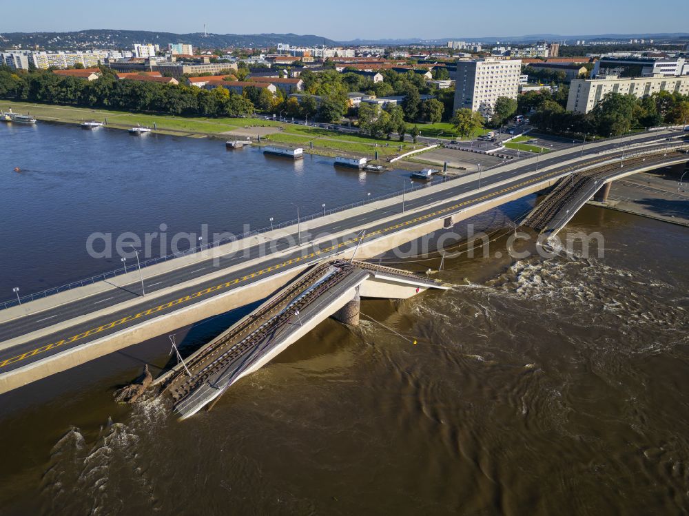 Aerial image Dresden - Concrete segments of the collapsed river bridge structure for crossing the Elbe Carolabruecke on the street Carolabruecke in Dresden in the federal state of Saxony, Germany, have fallen down into the riverbed of the Elbe