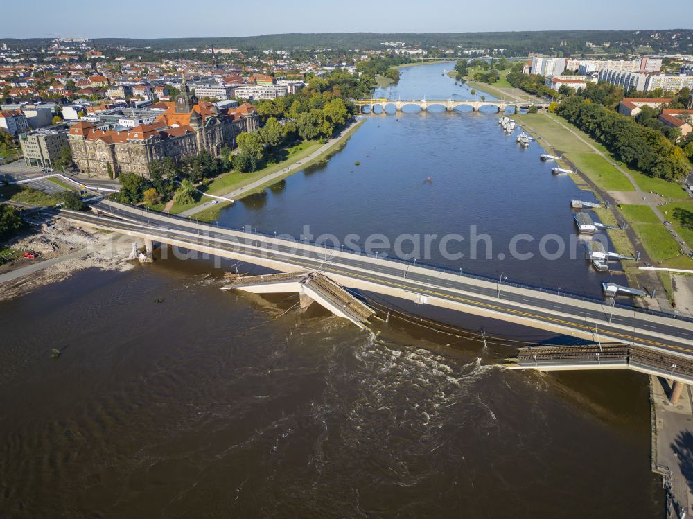 Aerial photograph Dresden - Concrete segments of the collapsed river bridge structure for crossing the Elbe Carolabruecke on the street Carolabruecke in Dresden in the federal state of Saxony, Germany, have fallen down into the riverbed of the Elbe