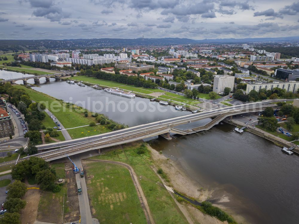 Dresden from above - Concrete segments of the collapsed river bridge structure for crossing the Elbe Carolabruecke on the street Carolabruecke in Dresden in the federal state of Saxony, Germany, have fallen down into the riverbed of the Elbe