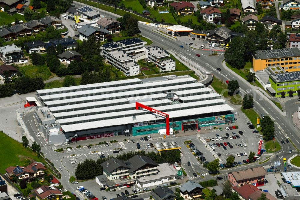 Saalfelden am Steinernen Meer from the bird's eye view: Building of the shopping center INTERSPAR on Leogangerstrasse in Saalfelden am Steinernen Meer in Salzburg, Austria