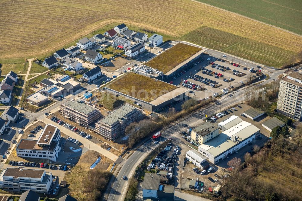 Heiligenhaus from above - Building of the shopping center and Supermarkt- Filiale von Rewe on Hoeseler Strasse in Heiligenhaus in the state North Rhine-Westphalia, Germany