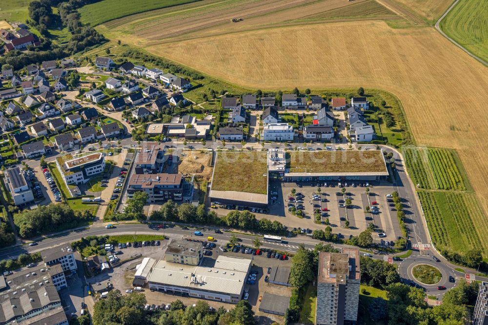 Heiligenhaus from above - Building of the shopping center and Supermarkt- Filiale von Rewe on Hoeseler Strasse in Heiligenhaus in the state North Rhine-Westphalia, Germany