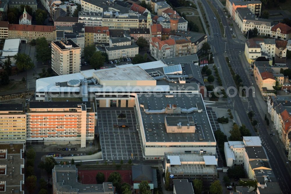 Cottbus from above - Shopping Mall Blechen Carre and Galeria Kaufhof store in Cottbus in the state of Brandenburg. The distinct triangular building includes several shops, stores and restaurants. Galeria Kaufhof is located in front of it