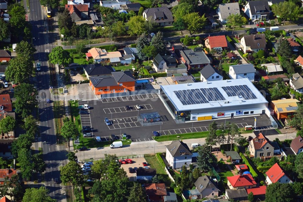 Berlin from the bird's eye view: Shopping center LIDL on Raststatter Strasse corner Hultschiner Damm in the district Mahlsdorf in Berlin, Germany