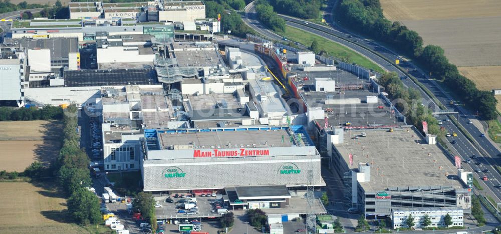 Aerial image Sulzbach - Blick auf das Einkaufszentrum MTZ Main-Taunus-Zentrum in Sulzbach / Hessen. Das Einzelhandelszentrum ist mit dem Eröffnungsjahr 1964 das älteste Einkaufszentrum der heute europaweit agierenden ECE Projektmanagement GmbH und der Prototyp des Einkaufszentrums. Das MTZ wurde umfassend modernisiert und erweitert und ist heute Hessens größtes Zentrum. Shopping center MTZ Main-Taunus - Center in Sulzbach / Hesse.