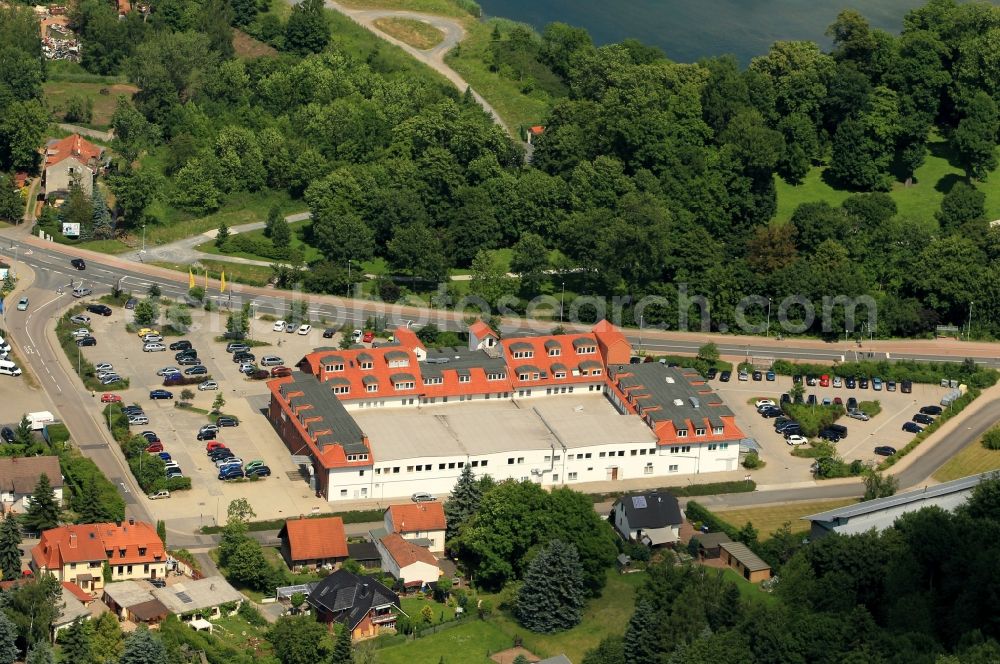 Aerial image Sondershausen - Not far from the castle park of special Hausen in Thuringia on the north houses street is a shopping mall. Aldi, Takko, Deichmann and penny Pfeifer have Filliale here. The shopping center has ample parking