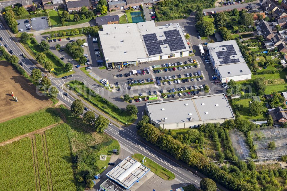 Aerial photograph Aldekerk - Building of the shopping center EDEKA-Center on the bypass road in Aldekerk in the federal state of North Rhine-Westphalia, Germany