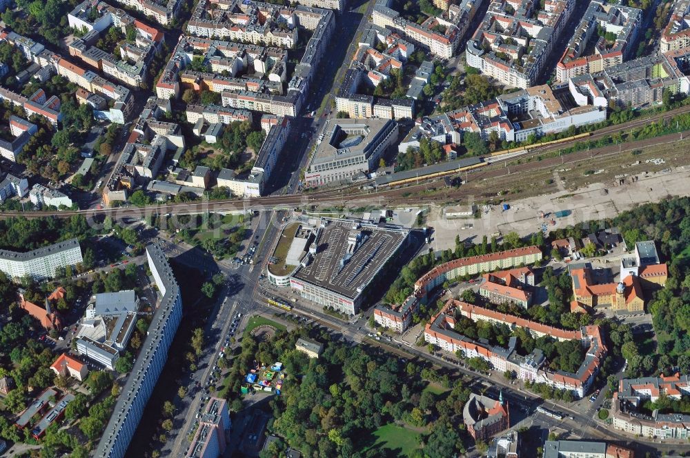 Aerial photograph Berlin - View of the mall Ring Center at Frankfurter Allee in Berlin. The shopping center on the border of the districts Friedrichshain and Lichtenberg consists of three individual buildings with space for commercial and retail stores as well as gastronomy. Operator of the building complex is the ECE Projectmanagement GmbH & Co. KG