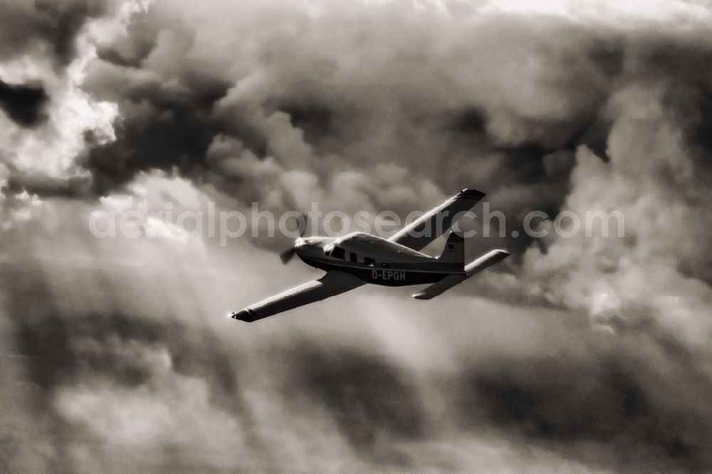 Flensburg from the bird's eye view: Single-engine business aircraft in the airspace in Flensburg in the state of Schleswig-Holstein