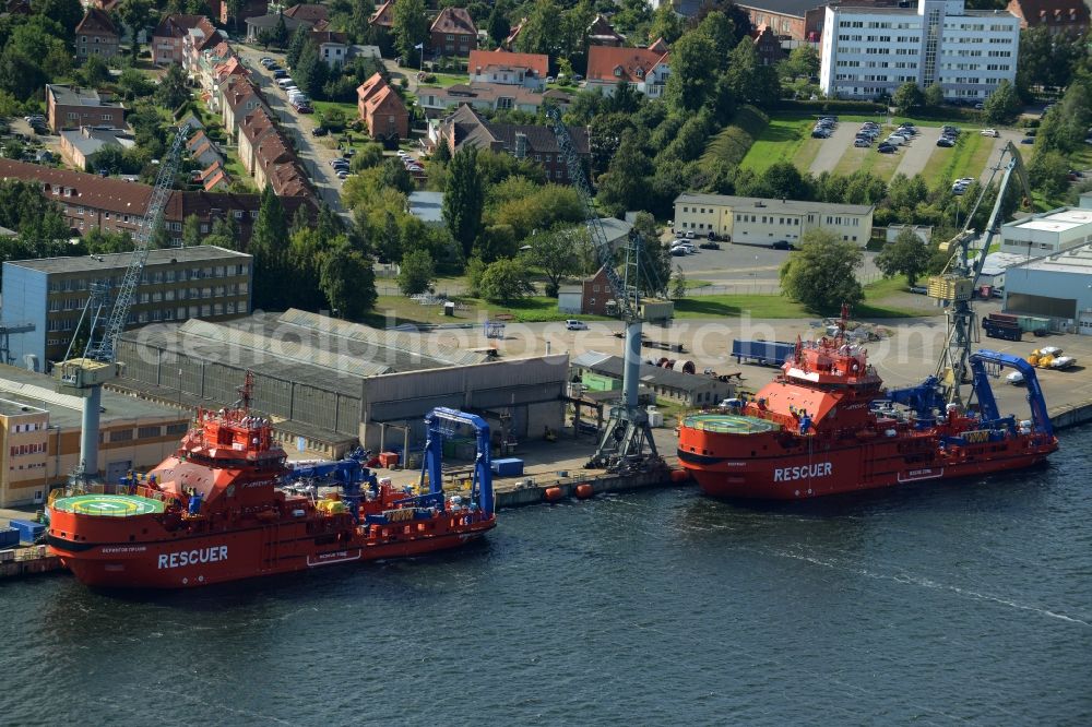 Wismar from above - Ice breaking rescue ships in front of Nordic Yards in Wismar in the state of Mecklenburg - Western Pomerania. The distinct red ships - Multipurpose Rescue and Salvage Vessel (MPRSV) - were ordered by the Russian Ministry of Transportation