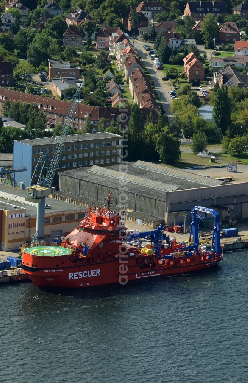 Aerial image Wismar - Ice breaking rescue ships in front of Nordic Yards in Wismar in the state of Mecklenburg - Western Pomerania. The distinct red ships - Multipurpose Rescue and Salvage Vessel (MPRSV) - were ordered by the Russian Ministry of Transportation