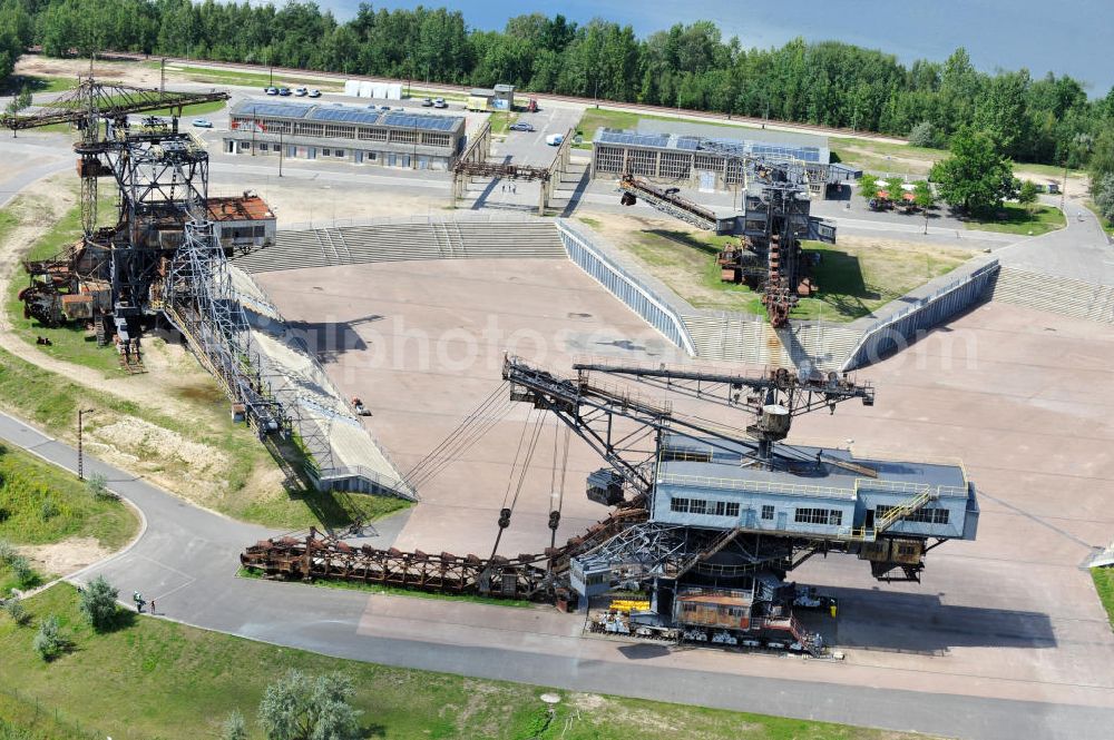 Gräfenhainichen from above - Die Eisenstadt Ferropolis entstand aus den Überresten des Braunkohle Tagebaus Golpa-Nord. Der Tagebau wurde geflutet. Einige Braunkohlebagger erinnern an den Tagebau. Heute finden in Ferropolis Festivals, Konzerte und an dere Veranstaltungen statt.Außerdem beherbergt die Halbinsel ein Museum. Ferropolis, called City of Metal. It is situated on the area of the former opencast mining Golpa-Nord. The opencast mining got flooded. Some of the huge excavators are situatet on the area. Today festivals, concerts and other events take place there. There also is a museum.