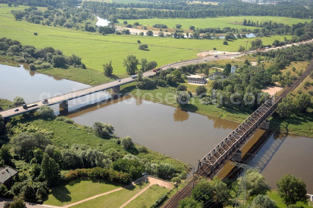 27.07.2009 from the bird's eye view: Blick auf verschiedene Brückenbauwerke an der Baustelle zum Ausbau der B184 zwischen Dessau und Roßlau in Sachsen-Anhalt. Auf dem Bild ist die Elbebrücke Roßlau zu sehen, zwei Brückenbauwerke über die Elbe bei Roßlau. Die B184 wird aufgrund des gestiegenen Verkehrsaufkommens zwischen 2006 und 2009 als vierstreifige Bundesstraße (RQ 20) über den Verlauf der Elbe hinweg ausgebaut. Bauherr ist der Landesbetrieb Bau Sachsen-Anhalt, die Projektleitung liegt bei SCHÜßLER - PLAN Berlin. Kontakt Projektleitung: Schüßler - Plan Ingenieurgesellschaft mbH, Tel. +49(0)30 42106 0, Email: berlin@schuessler-plan.de