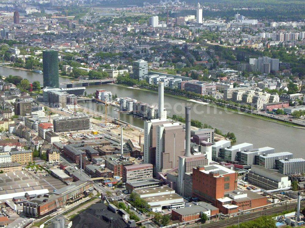 Frankfurt - Main / Hessen from the bird's eye view: Blick auf den Westhafen in Frankfurt/ Main. Im Vordergrund ist das Elektrizitätswerk und im Hintergrund ist der Westhafen Tower zu sehen. Das Elektrizitätswerk wird betrieben von der : Mainova AG, Solmsstraße 38, 60623 Frankfurt am Main Tel.: 069/ 213-02 Fax.: 069 /213-81122