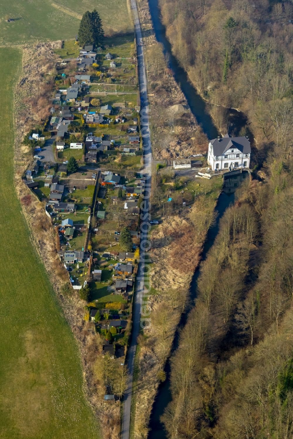 Arnsberg from above - The monument protected electricity plant at the mill race and the allotment garden area of the club Kleingaertnerverein Ruhrtal e.V. in Arnsberg in the state North Rhine-Westphalia