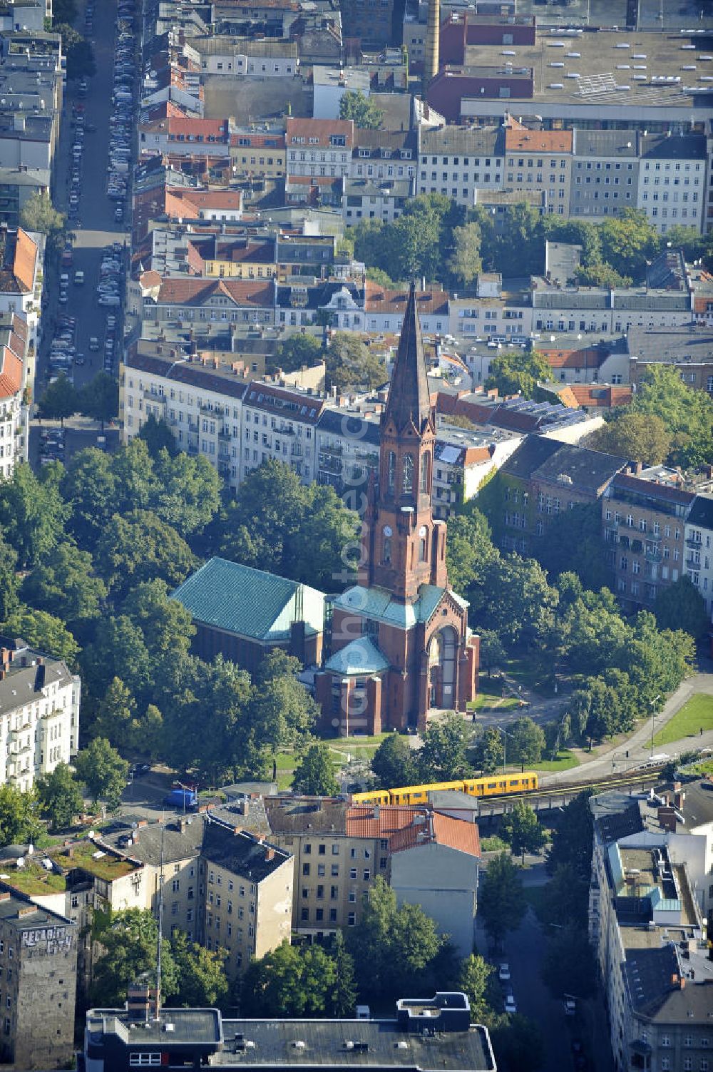 Berlin from above - Blick auf die Emmauskirche am Lausitzer Platz in Berlin- Kreuzberg. Die Planung und Leitung der Kirche wurde August Orth übertragen. Bis zu der Zerstörung des Kirchenschiffs 1945, war die im romanischen Stil gehaltene Emmauskirche mit dem 74 Meter hohem Turm, die Kirche mit den meisten Sitzplätzen in Berlin (ca. 2000). Zwischen 1957 und 1959 wurde ein wesentlich kleineres Kirchenschiff angebaut. View at the Emmaus Church on Lausitzer Platz in Berlin- Kreuzberg. The planning and management of the church August Orth has been transferred. Up to the destruction of the nave in 1945, the Romanesque-style Emmaus Church with the 74-meter high tower was the chruch with the most seats in Berlin. Between 1957 and 1959, a much smaller nave was added.