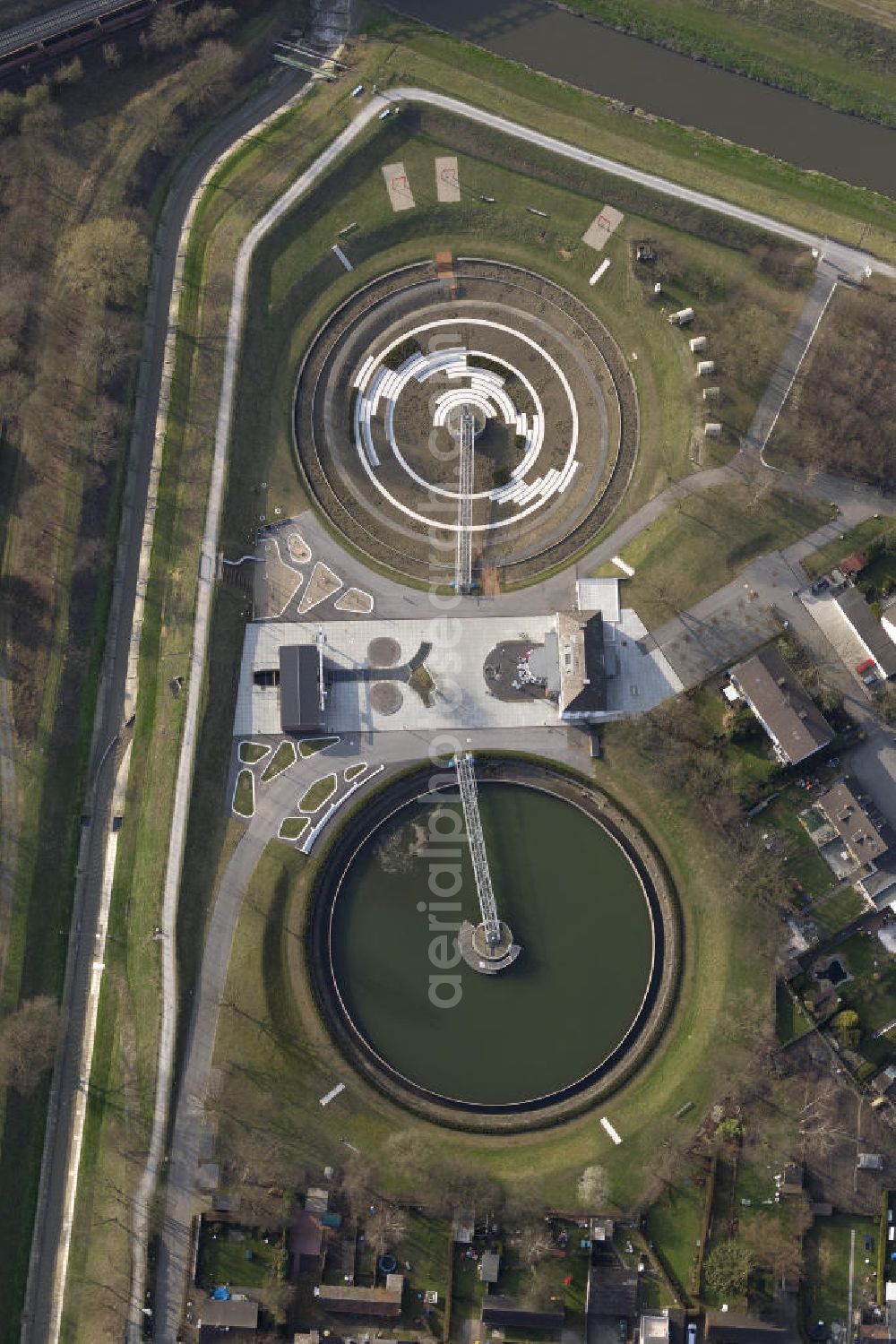 Bottrop from above - View the former sewage treatment plant BernePark. By Emschergenossenschaft the decommissioned wastewater treatment plant was converted into a park. The two clarifiers are converted from landscape artists