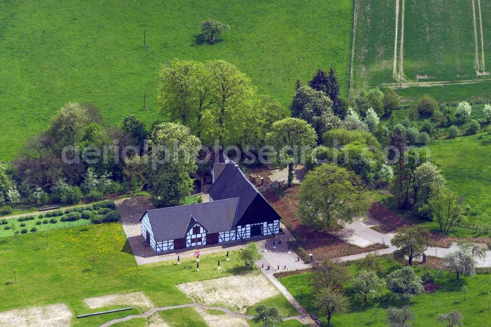 Holzwickede from the bird's eye view: View of the Emscherquellhof in Holzwickede in the state North Rhine-Westphalia. The Emscherquellhof is a timber-framed farm in the west of the Hixterwald