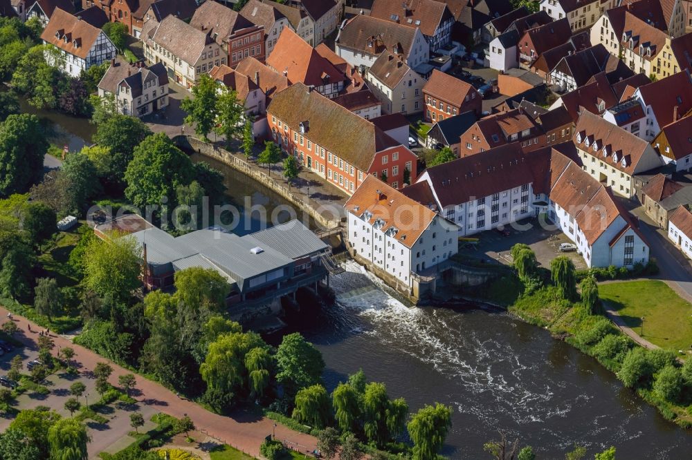 Warendorf from the bird's eye view: The weir on the Ems in Warendorf in the state North Rhine-Westphalia. On the weir at the building of the Emsmuehle is a bridge for pedestrians and behind is the Muehlenkolk 