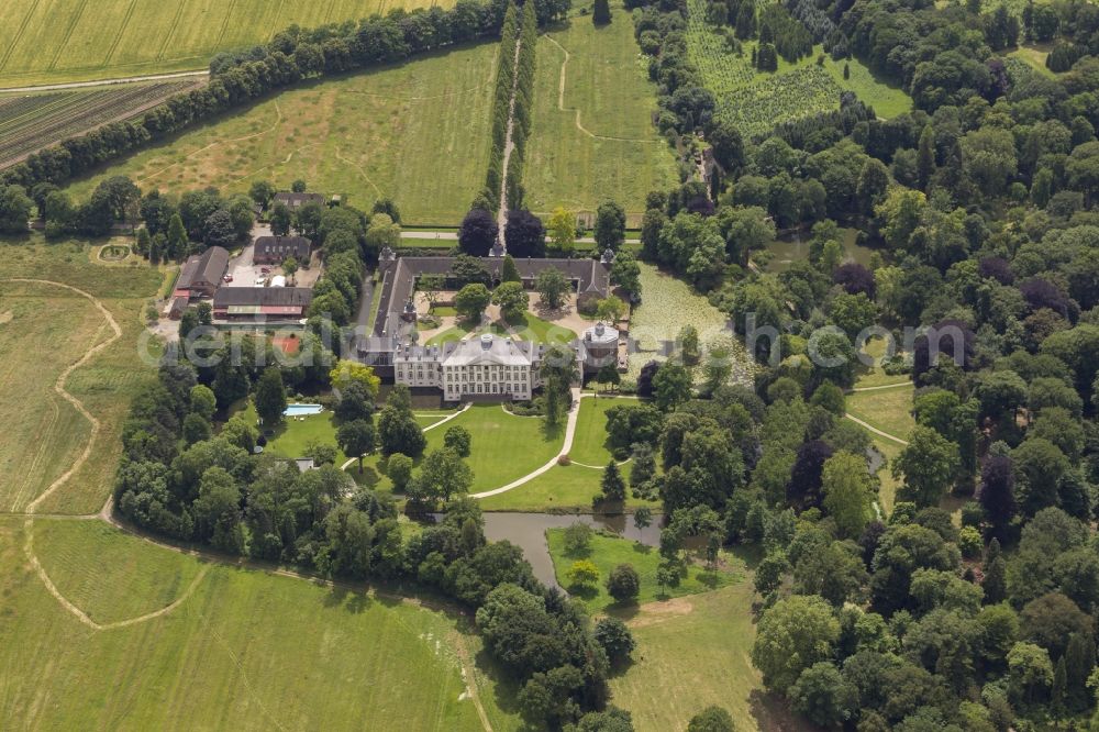 Düsseldorf from above - View of the English landscape garden, with the castle in the district of Düsseldorf Heltorf Angermund in the state of North Rhine-Westphalia. The castle was built for the management of agricultural and forestry products in the environment. There is a moated castle. Forestry is in the area since the 12th Century operated