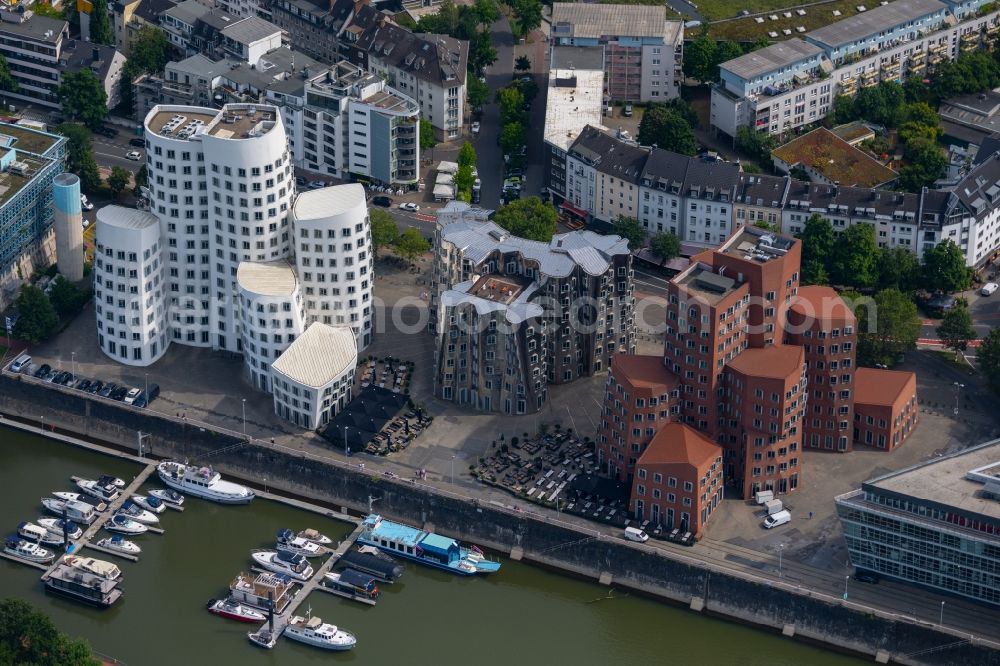 Aerial image Düsseldorf - Office building Neuer Zollhof on Medienhafen on Ufer of Rhein in Duesseldorf at Ruhrgebiet in the state North Rhine-Westphalia, Germany. The Neuer Zollhof is a building ensemble in the Duesseldorf Media Harbor. The buildings are also known as Gehry buildings after their architect and designer Frank Gehry