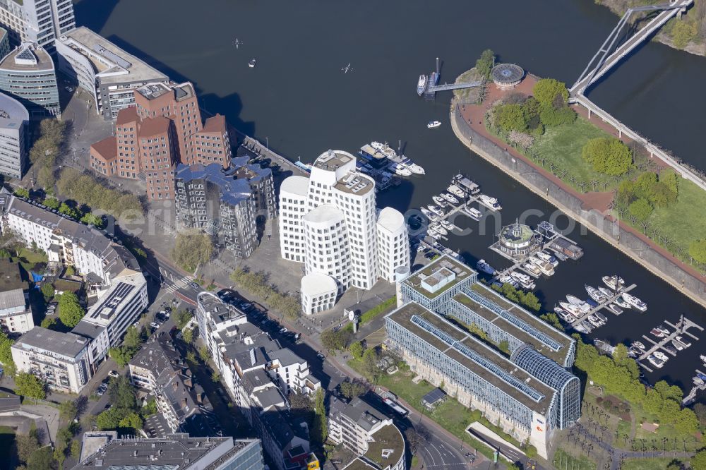 Unterbilk from above - Office building Neuer Zollhof on Medienhafen on Ufer of Rhein in Duesseldorf at Ruhrgebiet in the state North Rhine-Westphalia, Germany. The Neuer Zollhof is a building ensemble in the Duesseldorf Media Harbor. The buildings are also known as Gehry buildings after their architect and designer Frank Gehry