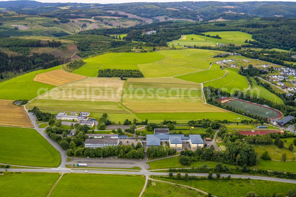 Aerial photograph Bad Berleburg - Ensemble of sports grounds and Rothaarbad Am Sportfeld in the district Am Stoeppelsweg in Bad Berleburg at Siegerland in the state North Rhine-Westphalia, Germany