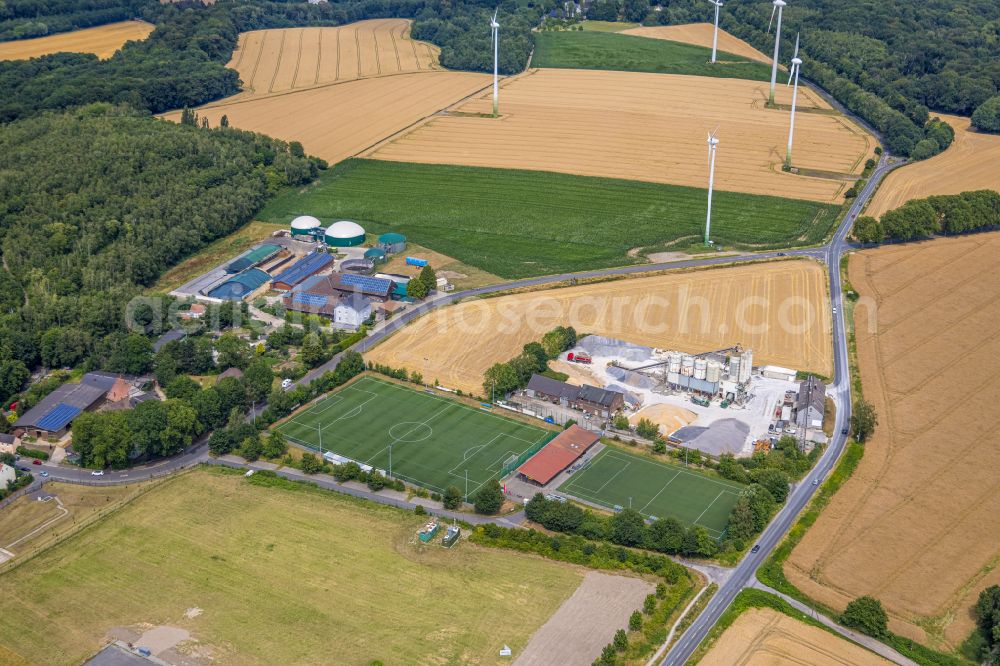 Castrop-Rauxel from above - Ensemble of sports grounds of Spvg Blau-Gelb Schwerin 20/26 e.V. and the concrete mixing plant of Maerkische Transportbeton GmbH on street Mengeder Strasse in the district Mengede in Castrop-Rauxel at Ruhrgebiet in the state North Rhine-Westphalia, Germany