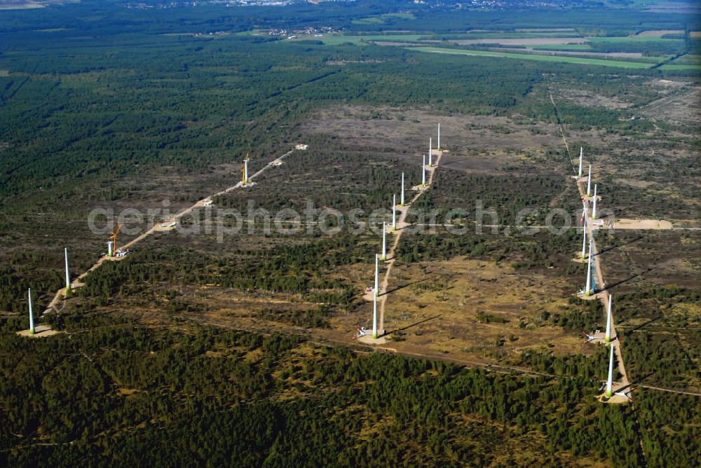 Aerial photograph Jüterborg - Blick auf die Entstehung eines Windparks im Teltow - Fläming in Brandenburg. In der Nähe der Stadt Jüterbog wird ein neuer Windkraftpark errichtet. Die Windräder haben den Zweck Windernergie in Strom umzuwandeln, der in das Stromnetz eingespeist werden kann. Es handelt sich dabei um 25 Windräder der Firma REpower Systems AG ( Standort Hamburg ). Kontakt: REpower Systems AG, Überseering 10 / Oval Office, 22297 Hamburg, Tel. +49(0)40 5555090 0, Fax +49(0)40 5555090 3999, Email: info@repower.de