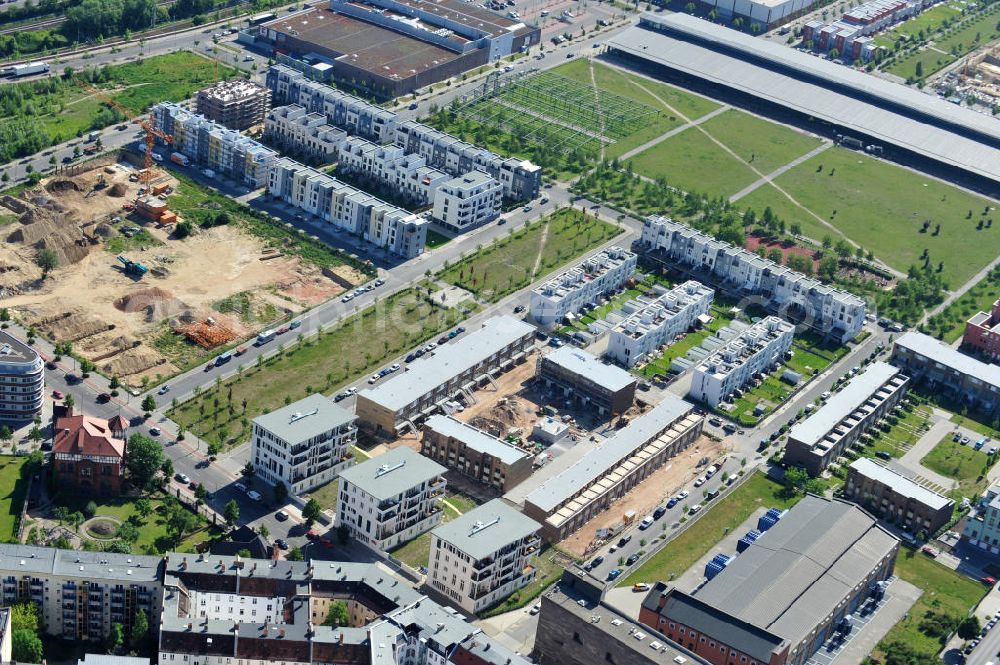 Aerial photograph Berlin Friedrichshain - Stadtteilansicht vom Areal Entwicklungsgebiet Alter Schlachthof / Eldenaer Straße. Hier entsteht ein neues Wohngebiet mit etwa 1300 Wohneinheiten in Lofts, Stadthäusern und Wohnungen, ca. 170000 qm Gewerbeflächen und Parkanlagen. Area of the development zone Alter Schlachthof / Eldenaer Strasse.