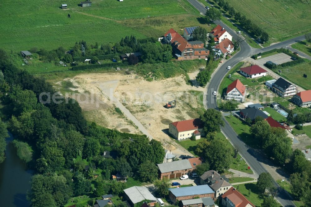 Hoppegarten from the bird's eye view: Development area and building land fallow on Dorfstrasse in the district Hoenow in Hoppegarten in the state Brandenburg, Germany