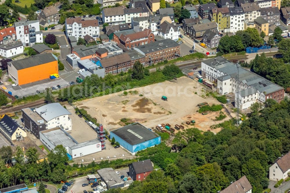 Ennepetal from the bird's eye view: Development area and building land fallow neben of Feuer- and Rettungswache on Wehrstrasse in Ennepetal in the state North Rhine-Westphalia, Germany