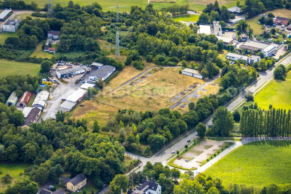 Aerial photograph Selbeck - Development area and building land fallow next to the factory premises of Economy Holzpackmittel GmbH on Koelner Strasse in Selbeck in the state North Rhine-Westphalia, Germany