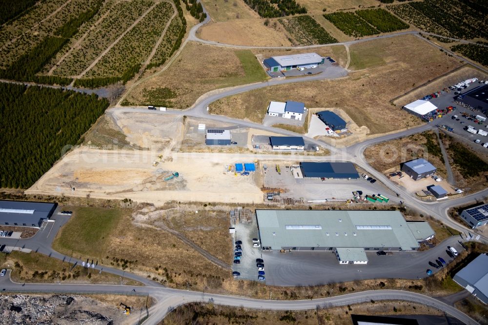 Schmallenberg from the bird's eye view: Development area and building land fallow in Gewerbegebiet on Kiefernweg - Buchenweg - Fichtenweg in Schmallenberg at Sauerland in the state North Rhine-Westphalia, Germany