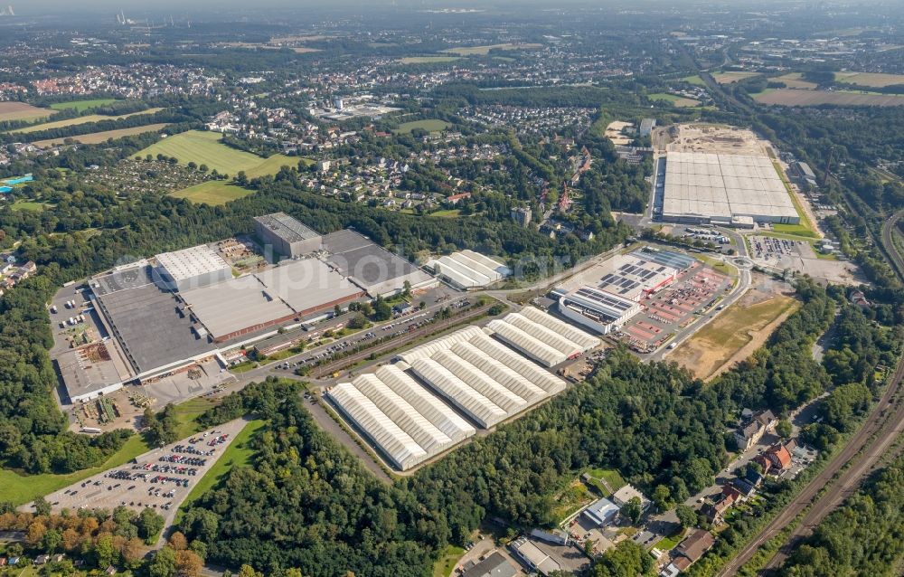 Aerial photograph Bochum - Development area of the former industrial and commercial area of the Opel-Flaeche next to the building of the branch of Baumarkt direkt GmbH & Co KG along the main street in Bochum in the state of North Rhine-Westphalia, Germany