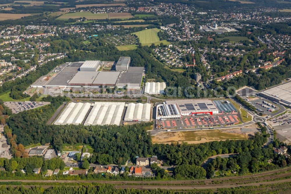 Bochum from above - Development area of the former industrial and commercial area of the Opel-Flaeche next to the building of the branch of Baumarkt direkt GmbH & Co KG along the main street in Bochum in the state of North Rhine-Westphalia, Germany