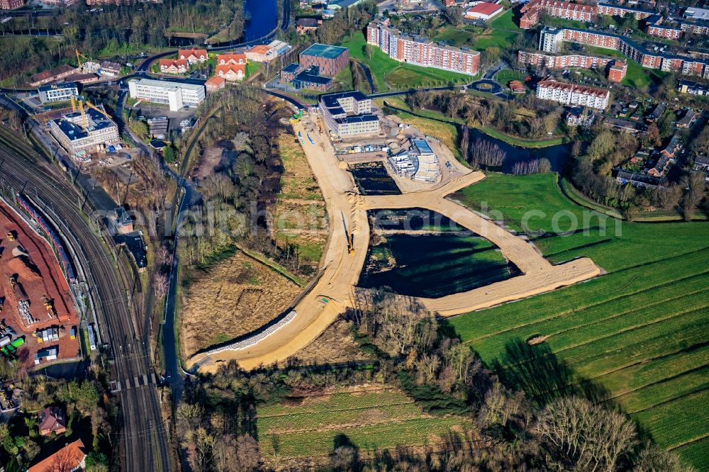 Aerial photograph Stade - Developing field of residential and commercial space Am Gueterbahnhof in Stade in the state Lower Saxony, Germany