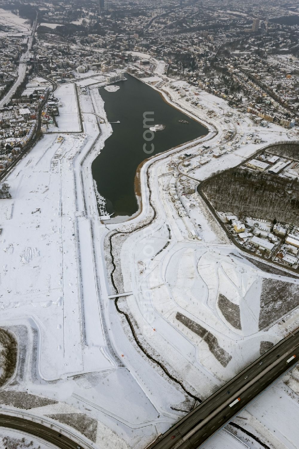 Aerial image Dortmund - Winter - Aerial view of snow-covered area of ??residential development at Phoenix Lake in Dortmund in North Rhine-Westphalia NRW. The Phoenix Lake is an artificial lake with buildable riparian zones on the former steelworks site Phoenix-East. Foto: Hans Blossey