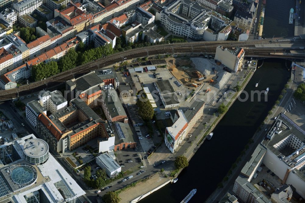 Aerial image Berlin - Developing field of residential and commercial space on Schiffbauerdamm on Spree river in the district Mitte in Berlin, Germany