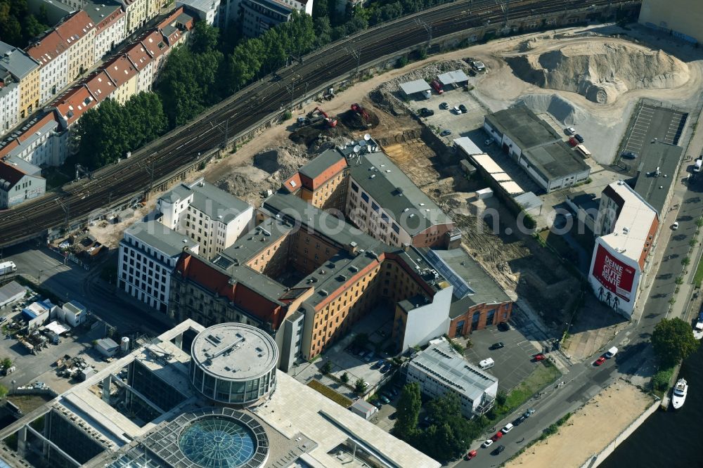 Aerial image Berlin - Developing field of residential and commercial space on Schiffbauerdamm on Spree river in the district Mitte in Berlin, Germany