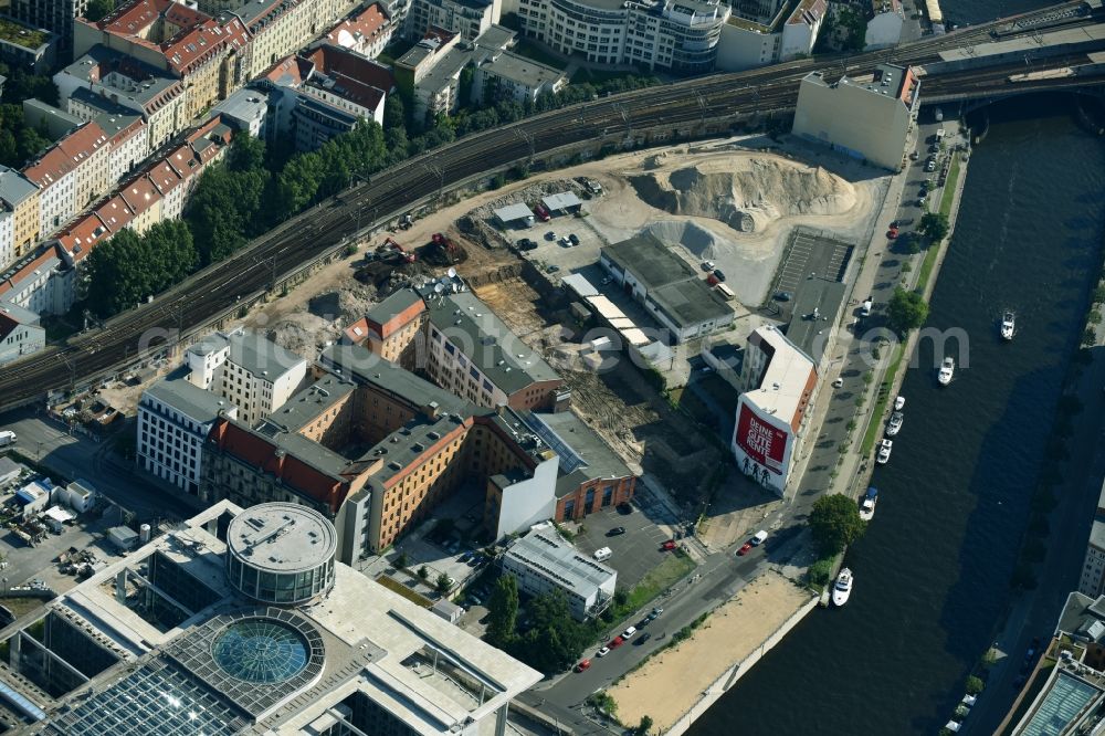 Aerial photograph Berlin - Developing field of residential and commercial space on Schiffbauerdamm on Spree river in the district Mitte in Berlin, Germany