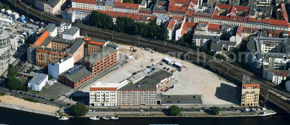 Berlin from the bird's eye view: Developing field of residential and commercial space on Schiffbauerdamm on Spree river in the district Mitte in Berlin, Germany