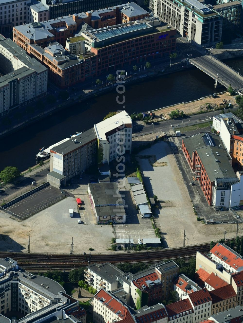 Berlin from above - Developing field of residential and commercial space on Schiffbauerdamm on Spree river in the district Mitte in Berlin, Germany