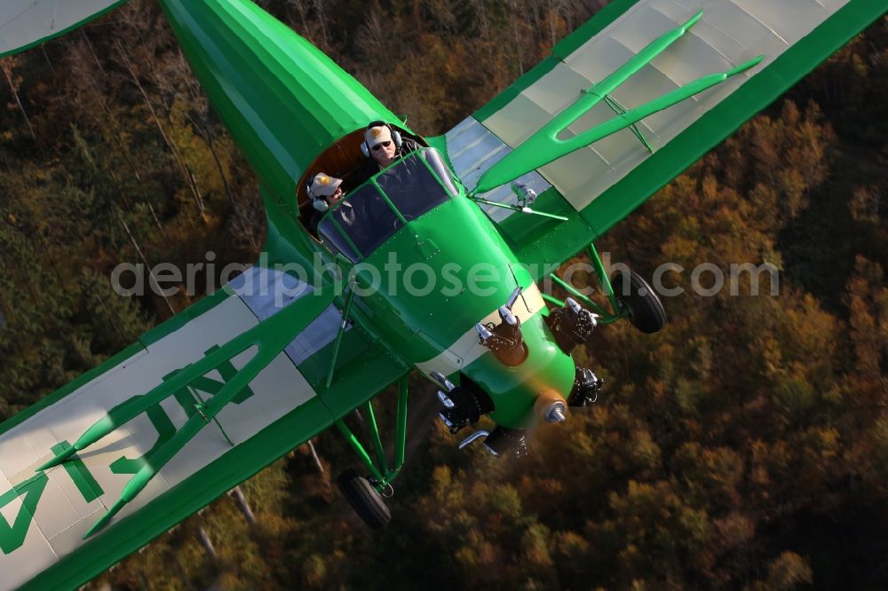 Aerial image Mengen - 1934er aircraft Kinner Sportster B with the identifier NC14201ueber the autumnal leaf forest landscape at levels in the state of Baden-Wuerttemberg