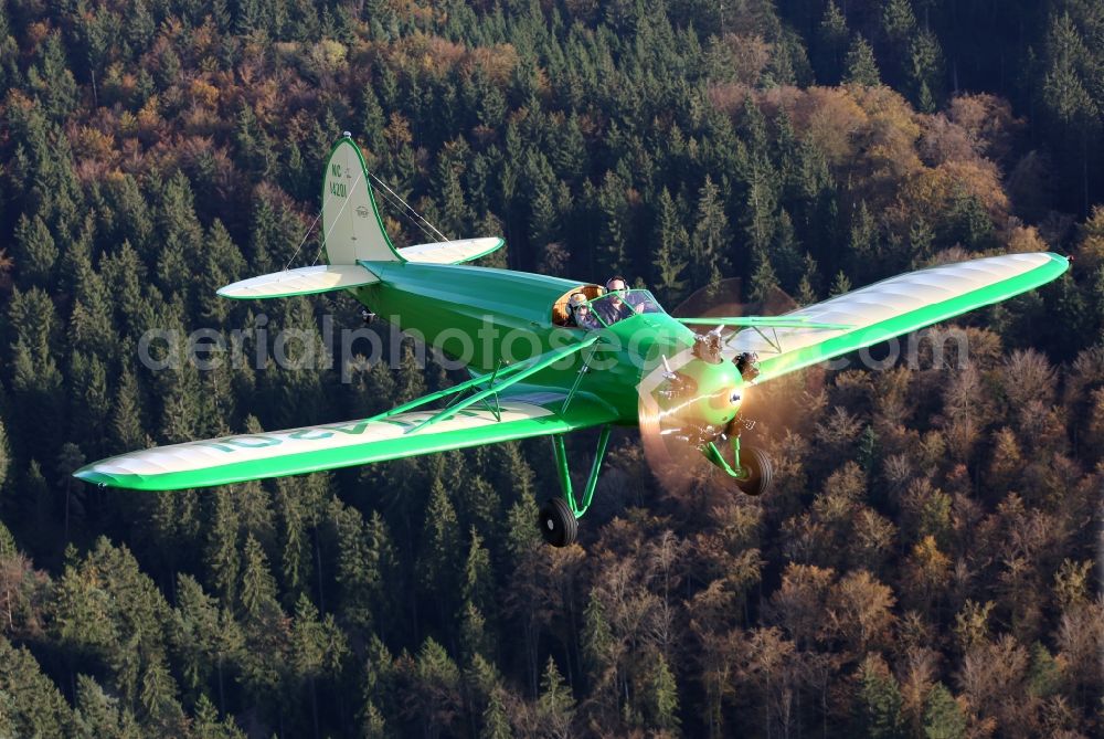 Aerial photograph Mengen - 1934er aircraft Kinner Sportster B with the identifier NC14201ueber the autumnal leaf forest landscape at levels in the state of Baden-Wuerttemberg
