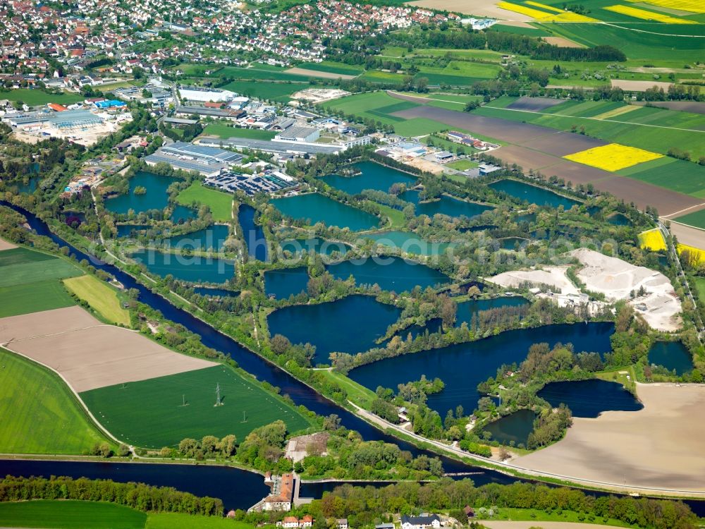 Erbach from the bird's eye view: Erbach and its still waters in the Alb-Danube-Region in the state of Baden-Württemberg. Erbach is a small town on the Northern riverbank of the Danube from which it is separated by small still waters. These are fish ponds, ponds and quarry ponds. The waters border the industrial area of the town