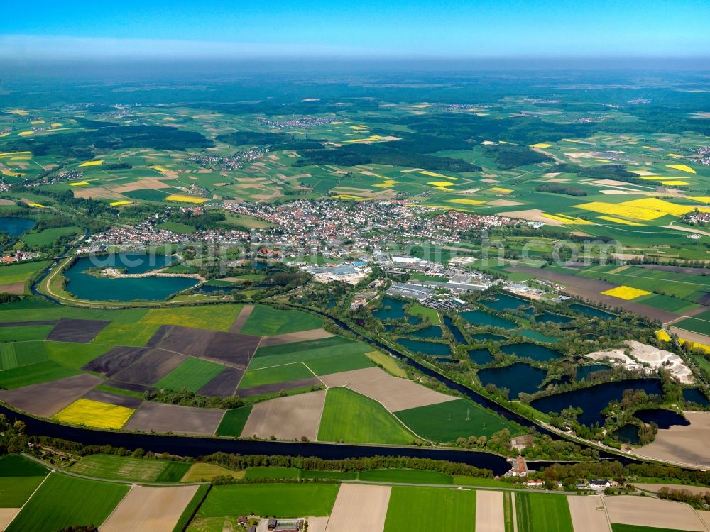 Aerial image Erbach - Erbach and its still waters in the Alb-Danube-Region in the state of Baden-Württemberg. Erbach is a small town on the Northern riverbank of the Danube from which it is separated by small still waters. These are fish ponds, ponds and quarry ponds. The waters border the industrial area of the town