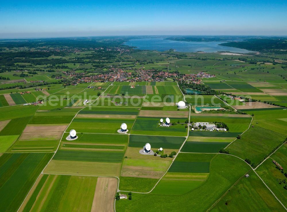 Raisting from the bird's eye view: Satellite Earth Station in Raisting in the state of Bavaria. The station for communicating with news satellites is a landmark of the region. Its dish antennas and the elaborate Radom Raisting - a ball shaped airhouse which was built in 1964 - are widely visible in the landscape. The Radom with the Antenna 1 is listed as a protected building