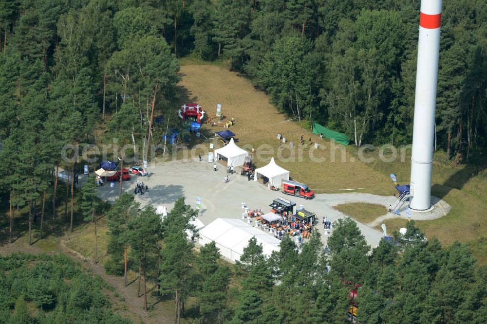 Sallgast from above - Opening party of the forest- windpark Goellnitz-Lieskau-Rehain in Sallgast in the state of Brandenburg. Developed by UKA the largest forest windpark of Germany opens with tents, drinks and stands on the foot of a turbine in a forest